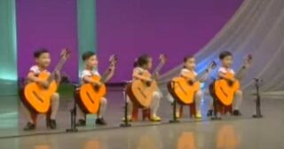 North Korea children playing the guitar